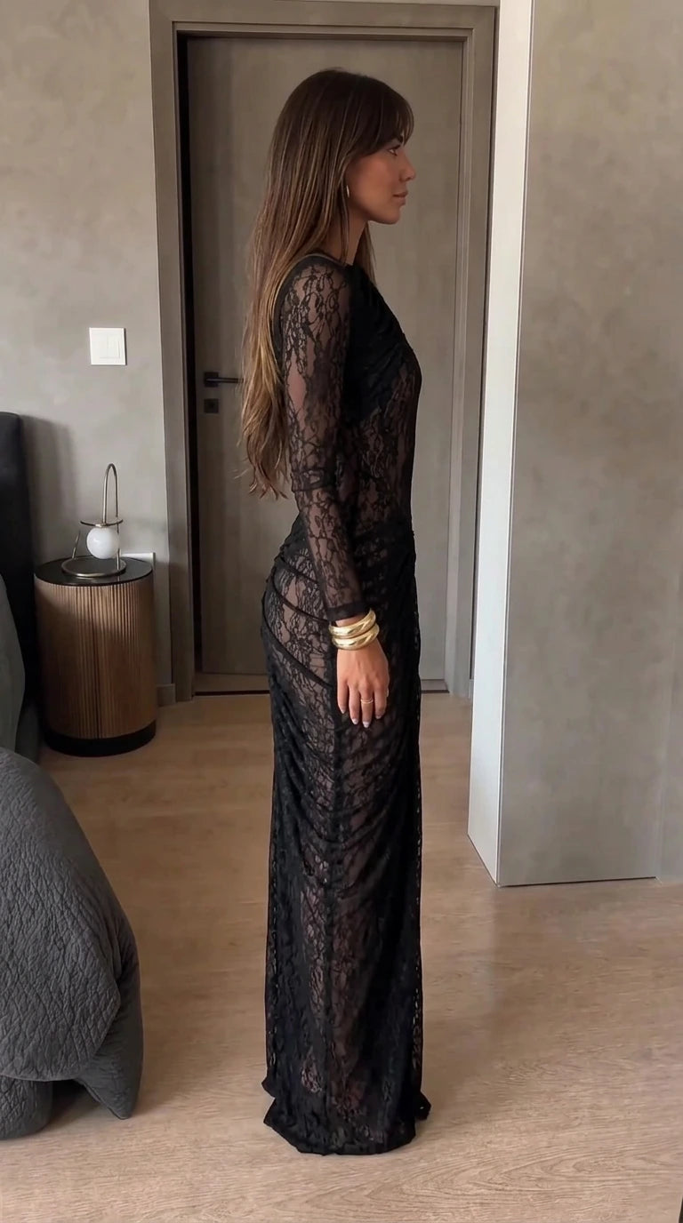 Side profile of woman wearing black ruched lace evening dress