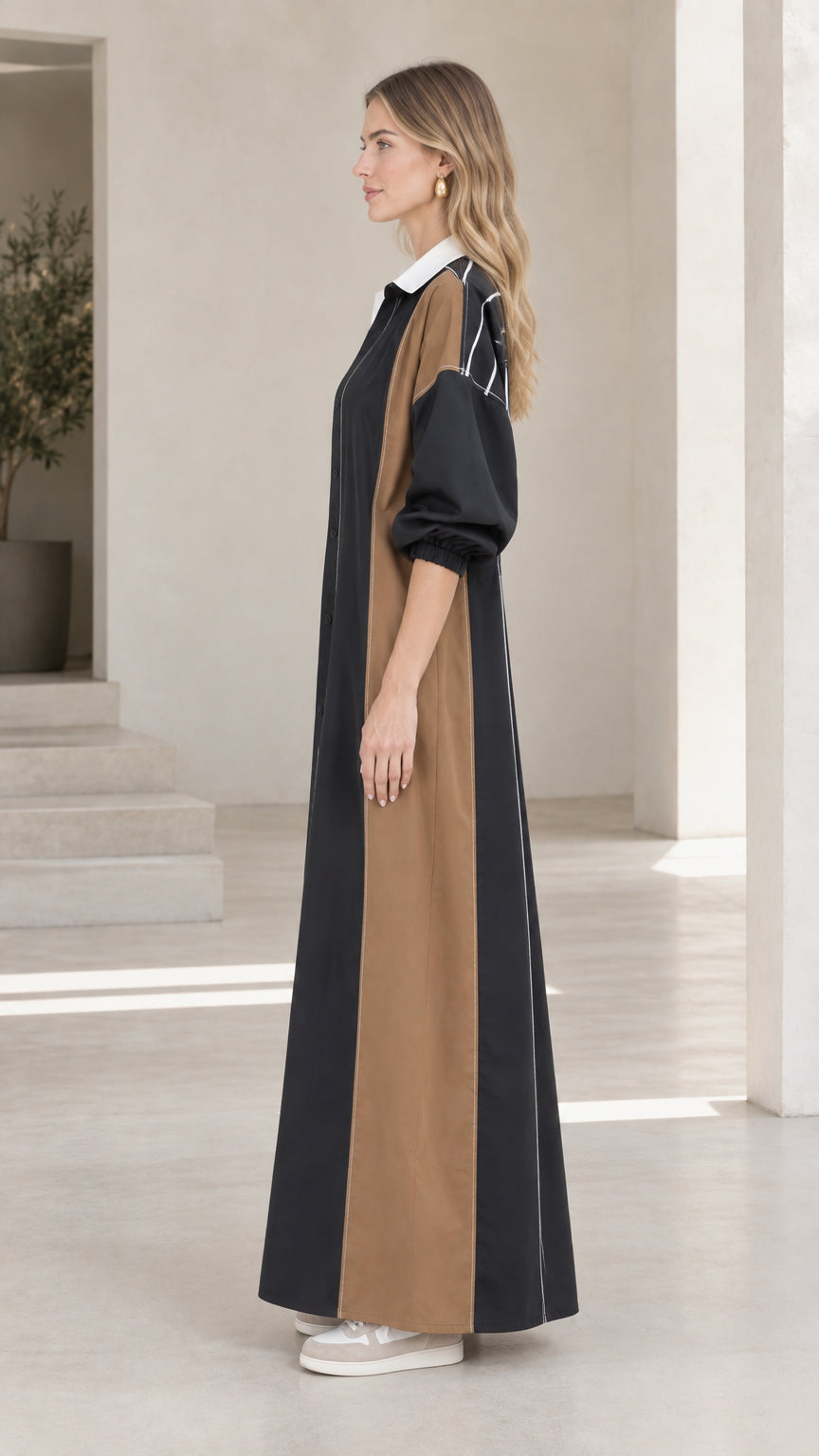 Side profile of Black colorblock maxi dress showing longline flow and silhouette