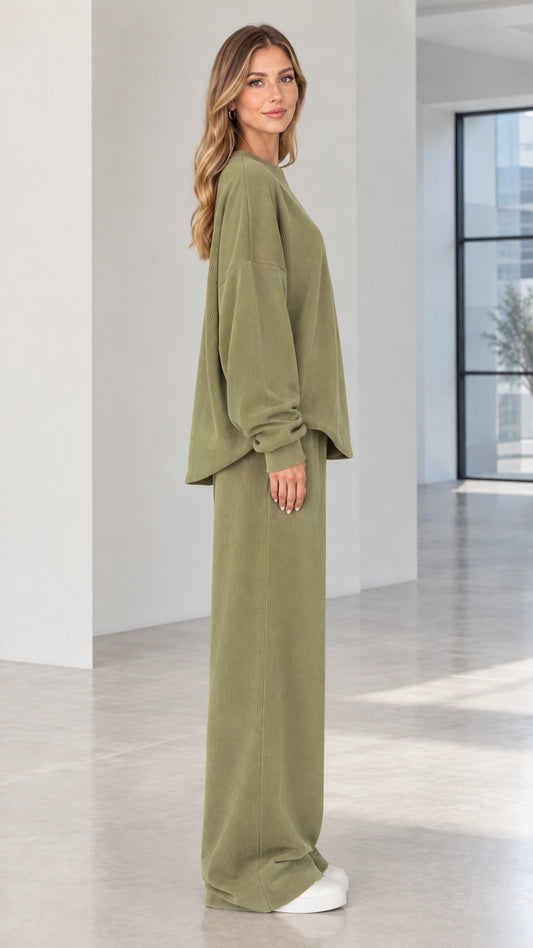 Side angle of woman wearing olive green two-piece ribbed matching lounge set