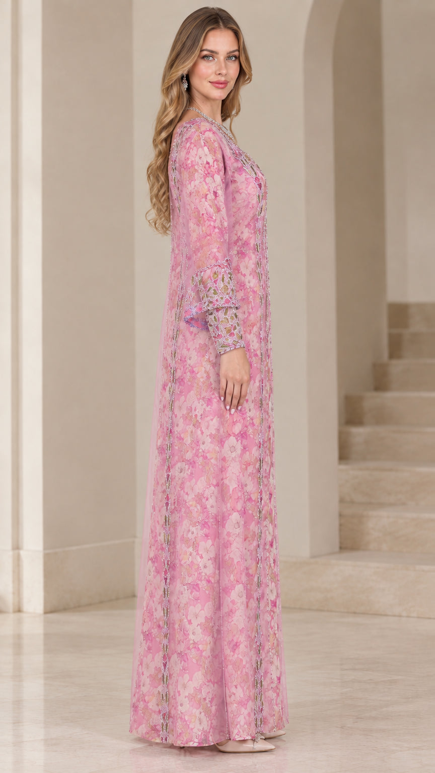 Side profile of woman wearing pink floral chiffon kaftan dress