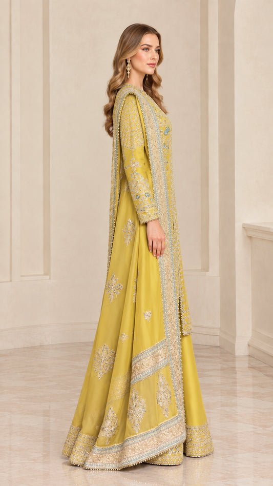 Side profile view of woman modeling Mustard Gold embroidered tunic and flared pants