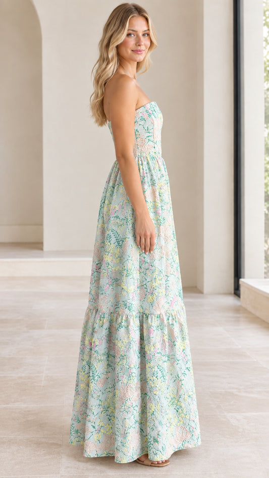 Side view of mint green strapless floral jacquard gown with tiered skirt