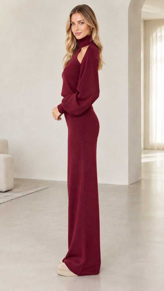 Side view of woman wearing burgundy knit two-piece sweater and wide-leg lounge pants