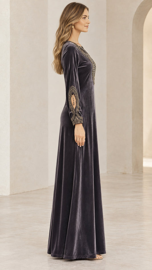 Side profile of model wearing Charcoal Grey long sleeve velvet maxi gown
