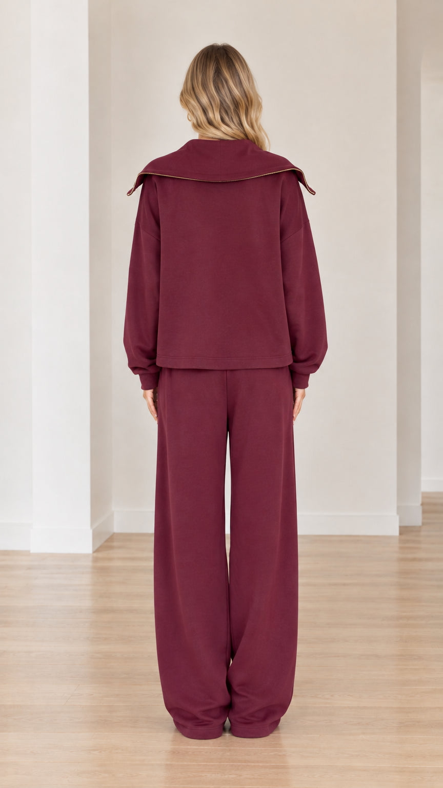Back view of model showing oversized sailor collar on burgundy half-zip pullover set