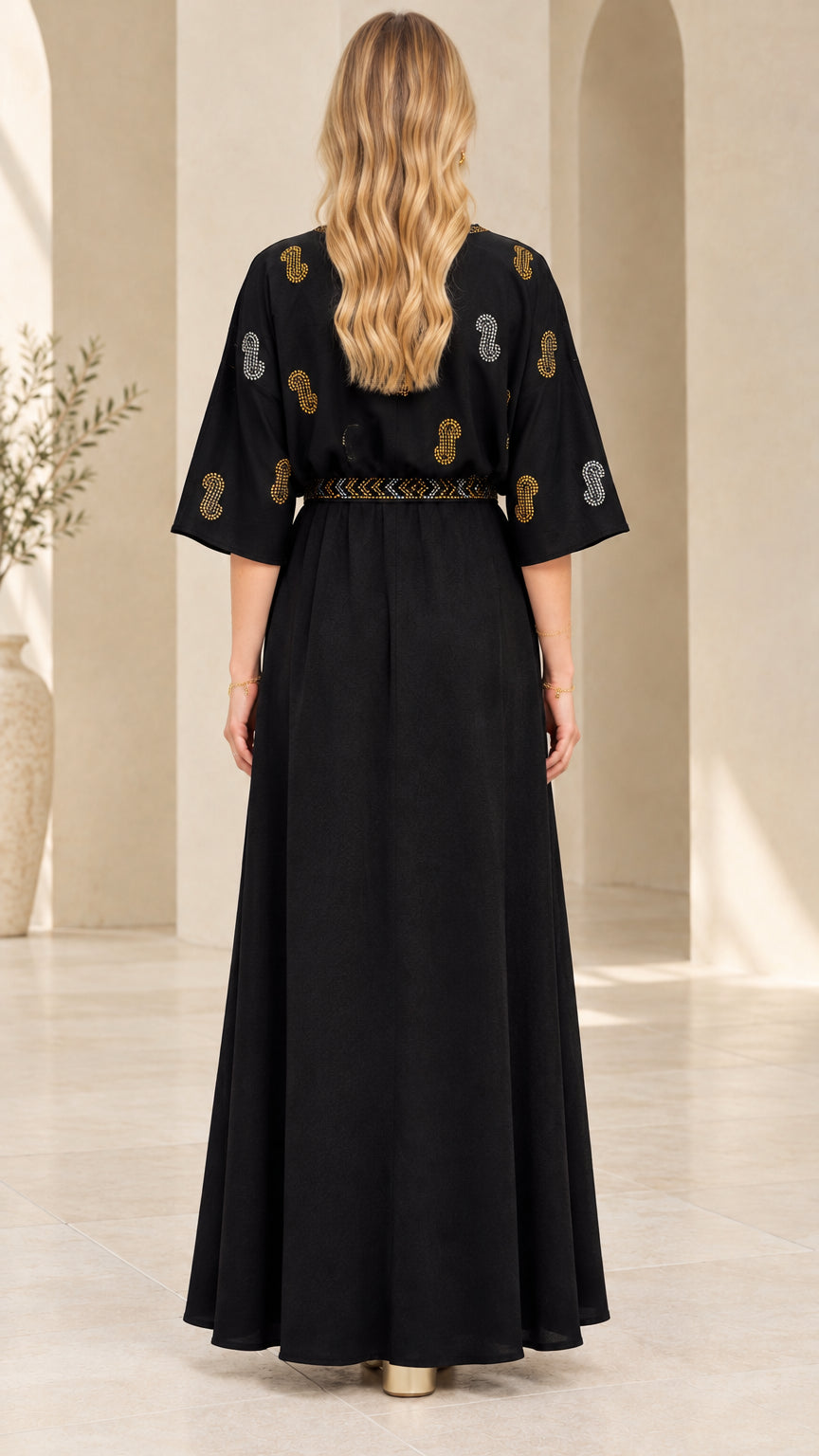Rear back view showing the relaxed drape of the black maxi dress