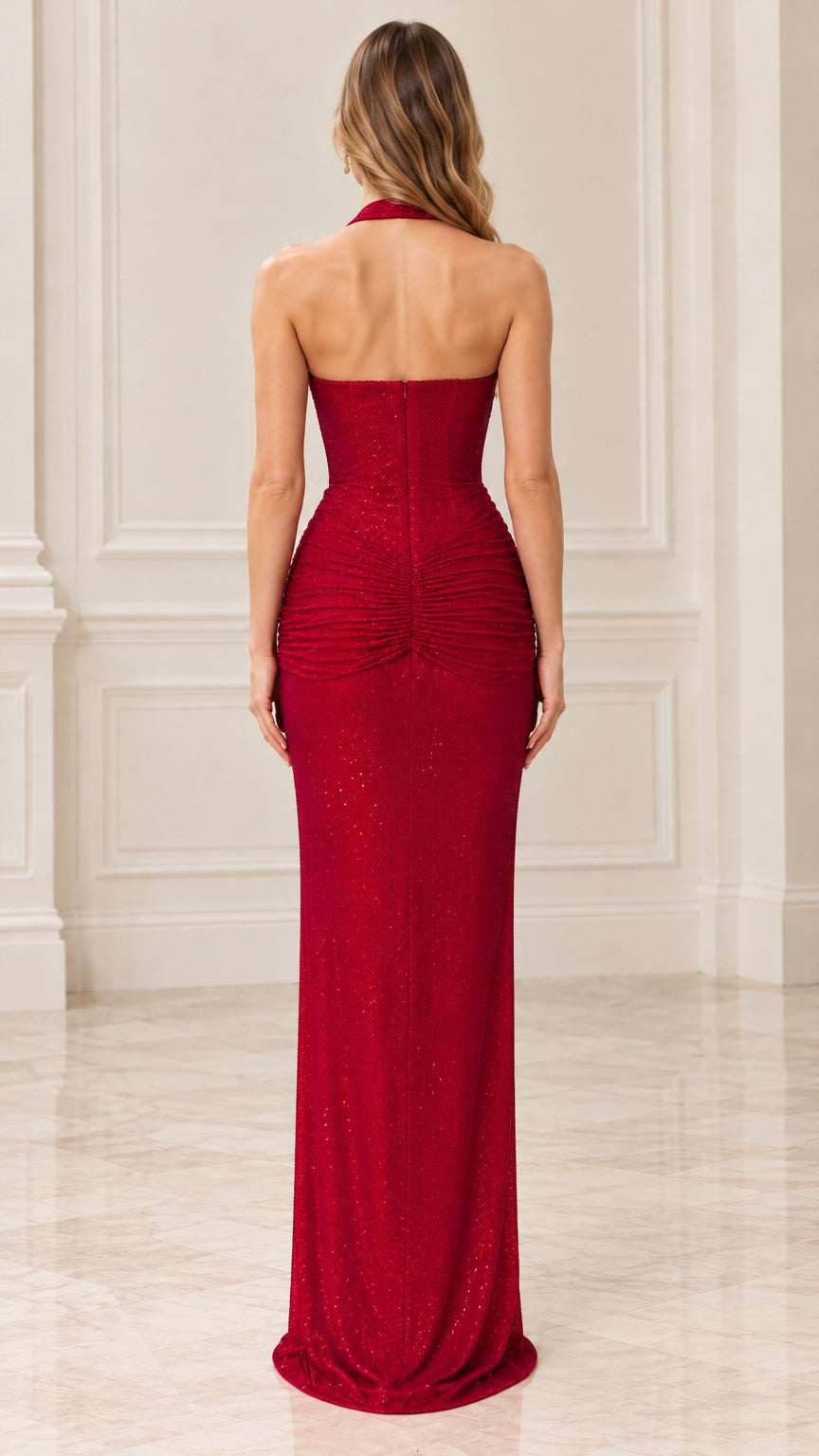 Back view of red halter evening dress highlighting open back design
