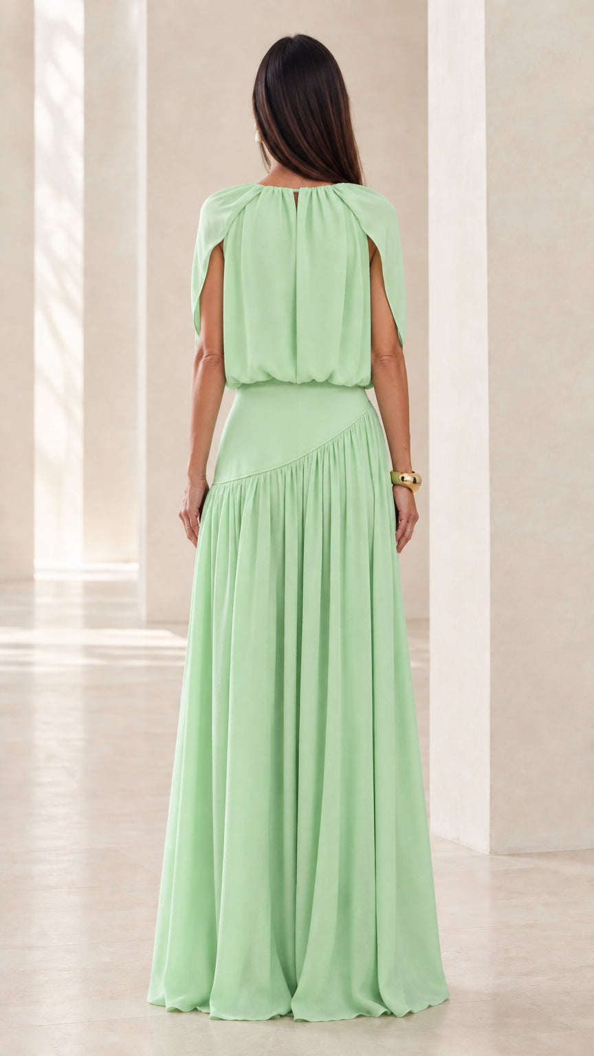 Back view of model wearing Mint Green floor-length cape dress
