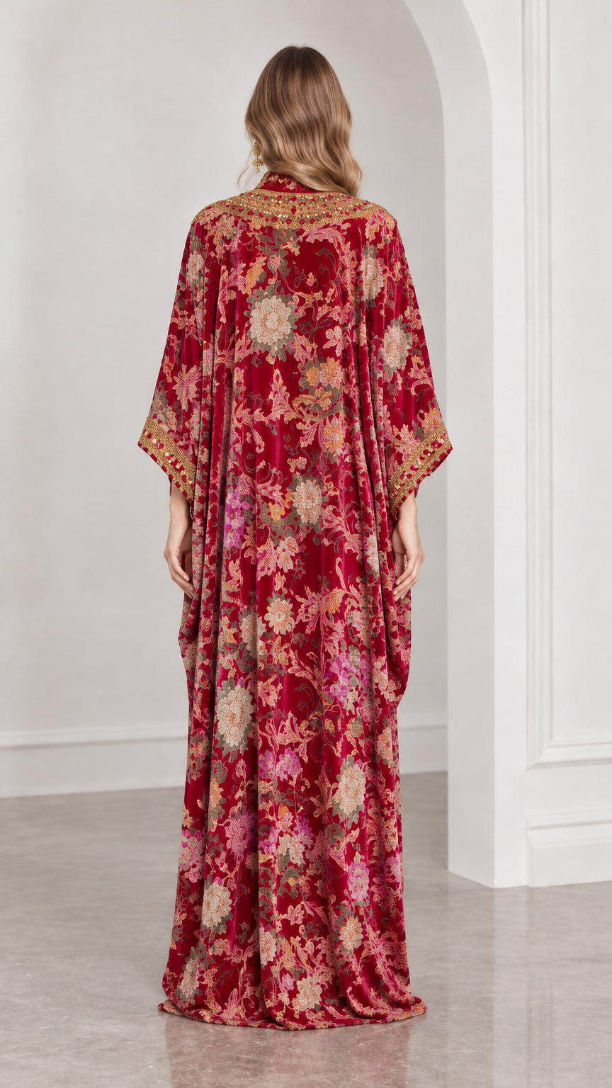 Back full-length view of burgundy floral velvet kaftan gown