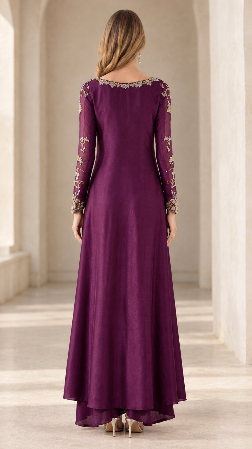 Back full-length view of woman in plum embroidered long tunic and pants set