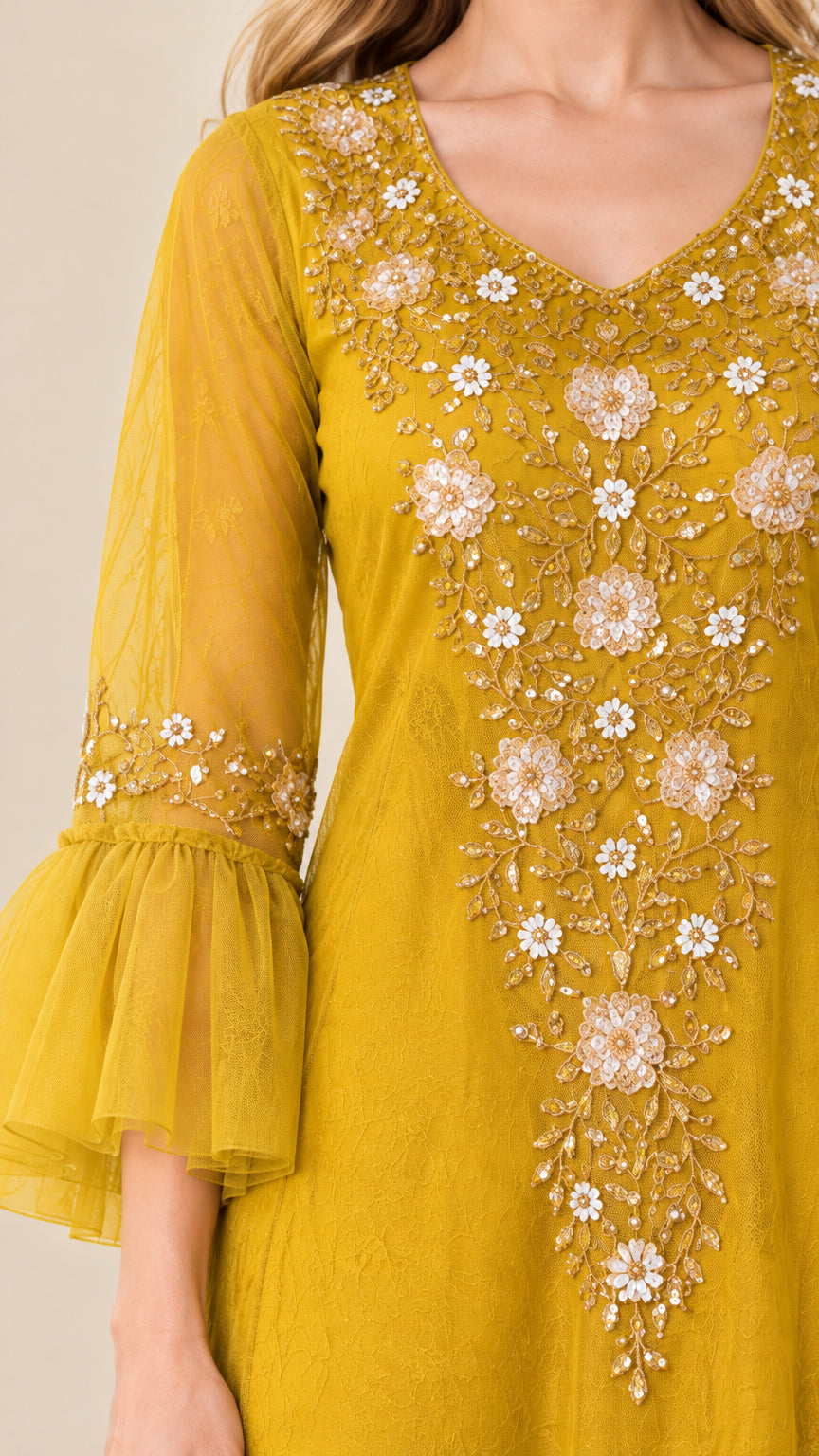 Close-up of intricate floral embroidery on mustard yellow V-neck bodice