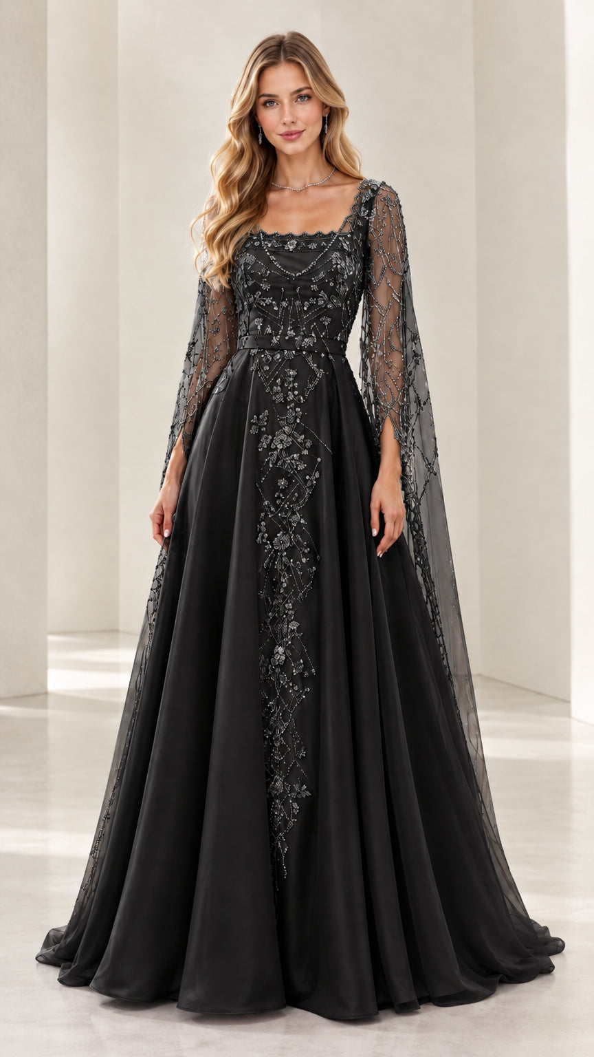Woman wearing black embroidered beaded A-line evening gown with cape sleeves