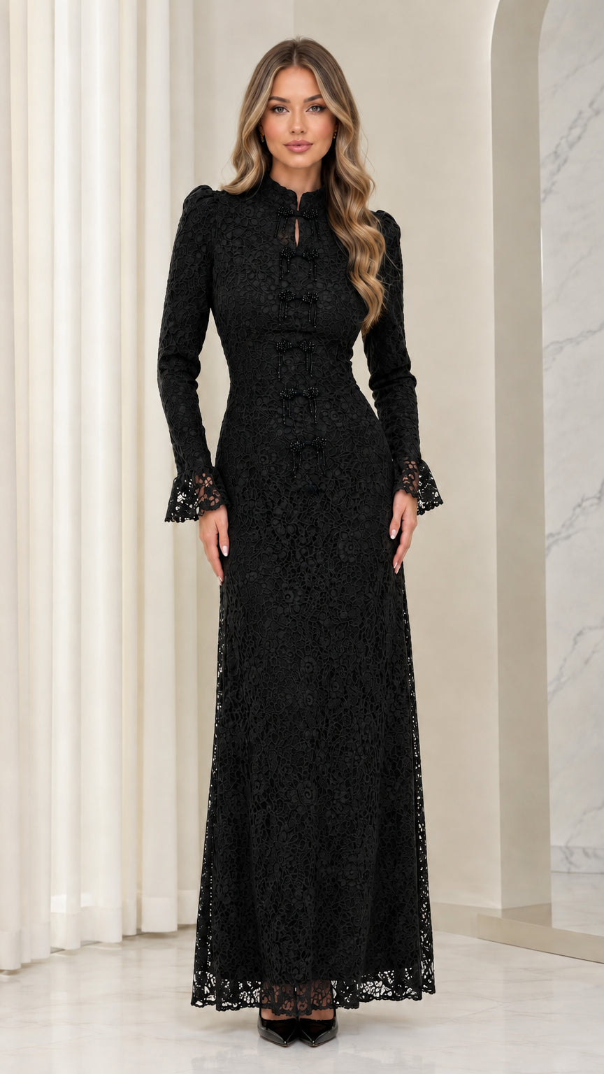 Front full view of woman wearing black floral lace long-sleeve maxi dress