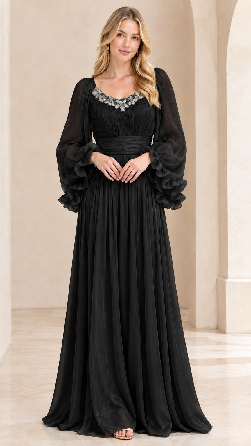 Front view of model wearing Black beaded pleated chiffon evening gown with tiered ruffle sleeves
