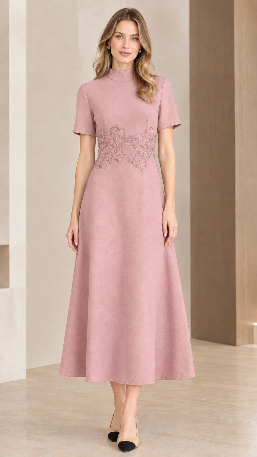 Woman wearing dusty pink mock neck A-line midi dress with floral waist detailing