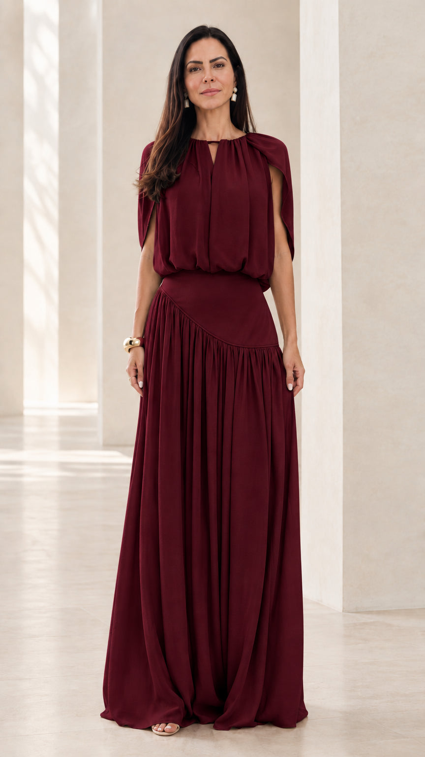 Front view of model wearing Burgundy wine red cape sleeve asymmetrical maxi dress