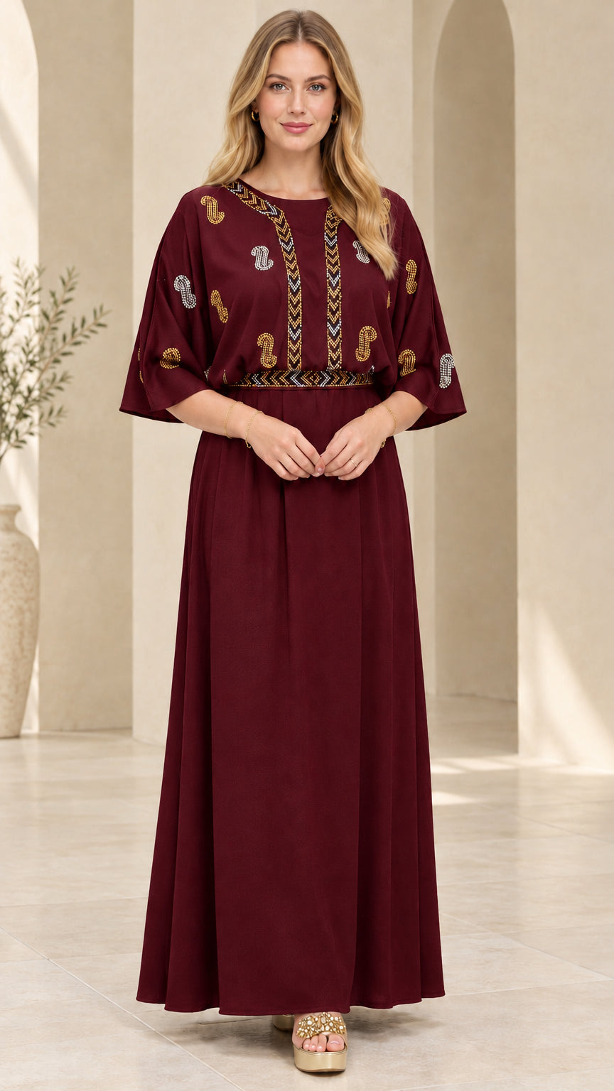 Front view of model wearing the burgundy red embellished kaftan maxi dress