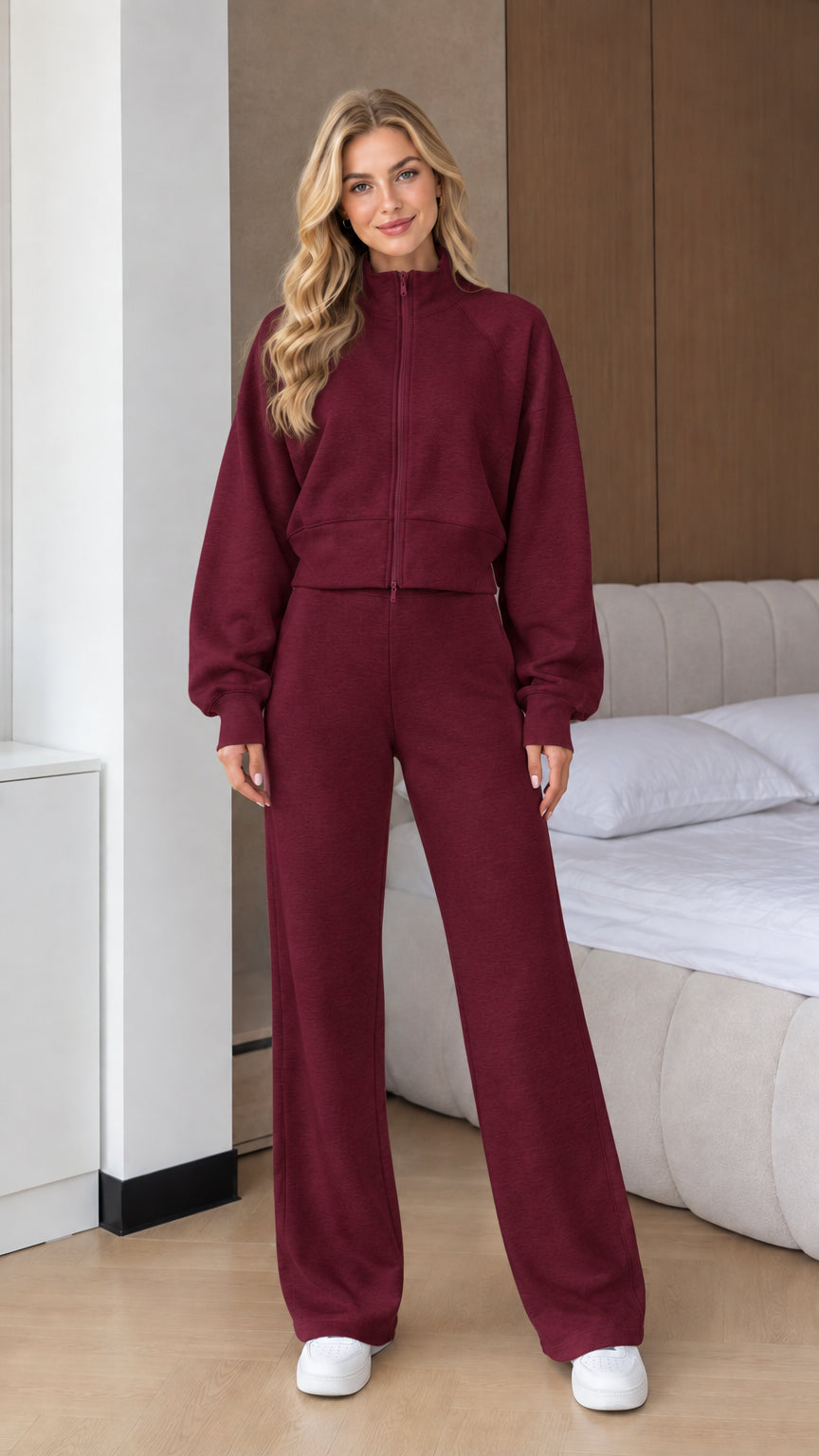 Front view of woman wearing Burgundy 2-piece zip-up sweatshirt and wide leg pants set