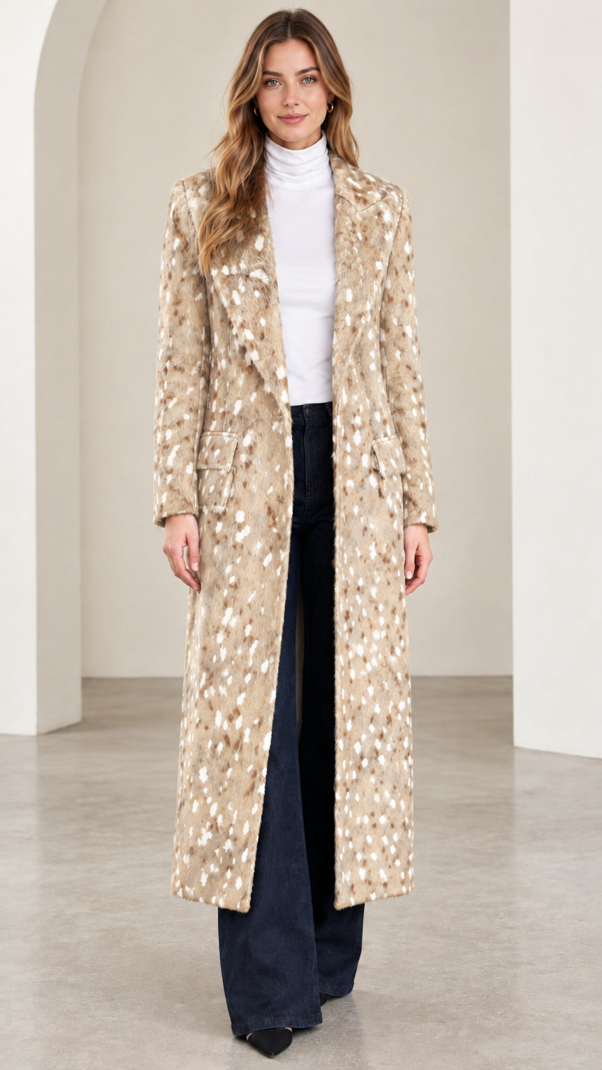 Front view of woman wearing beige speckled tailored maxi coat