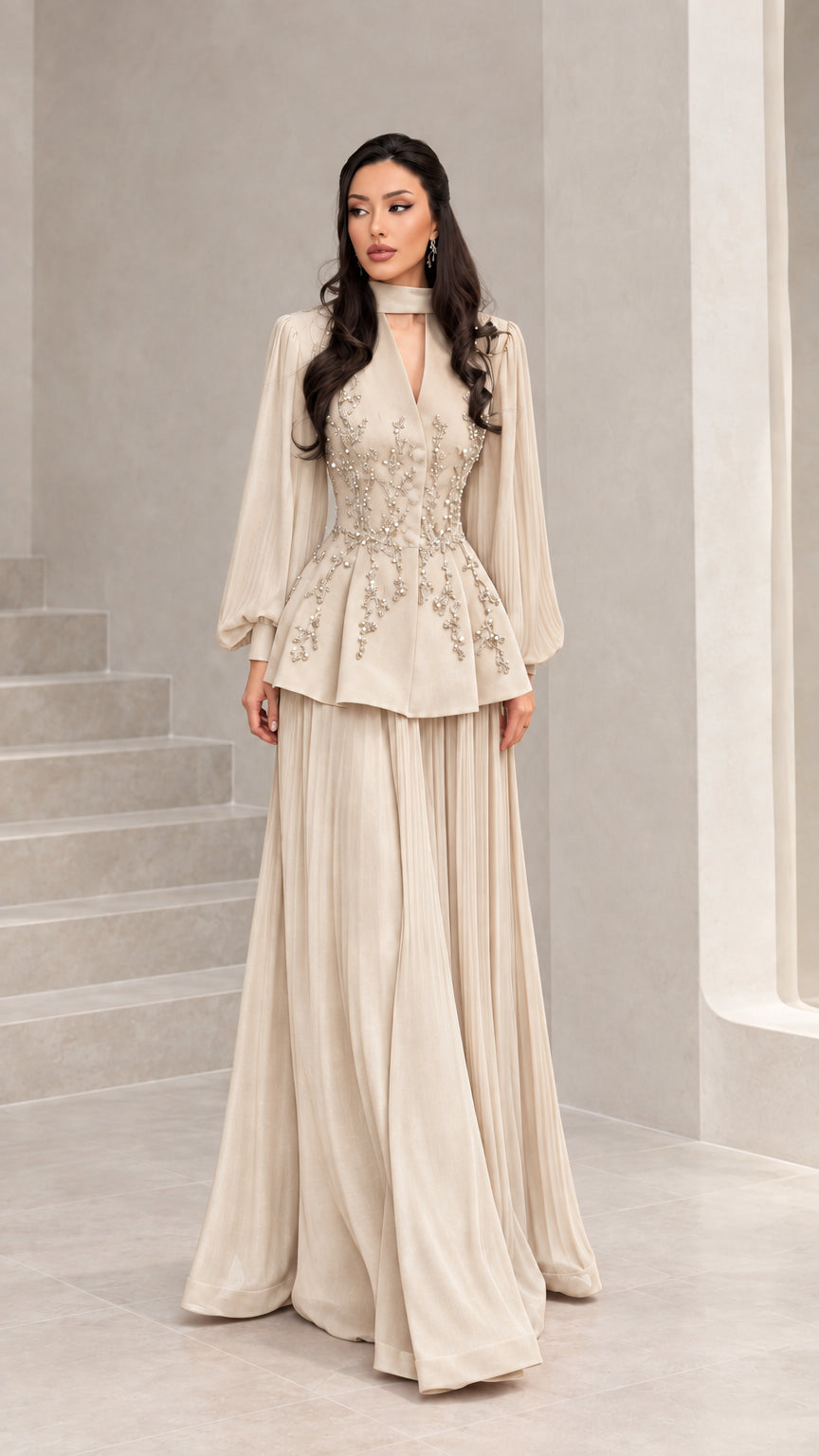 Front view of champagne beige long-sleeve embellished peplum evening dress