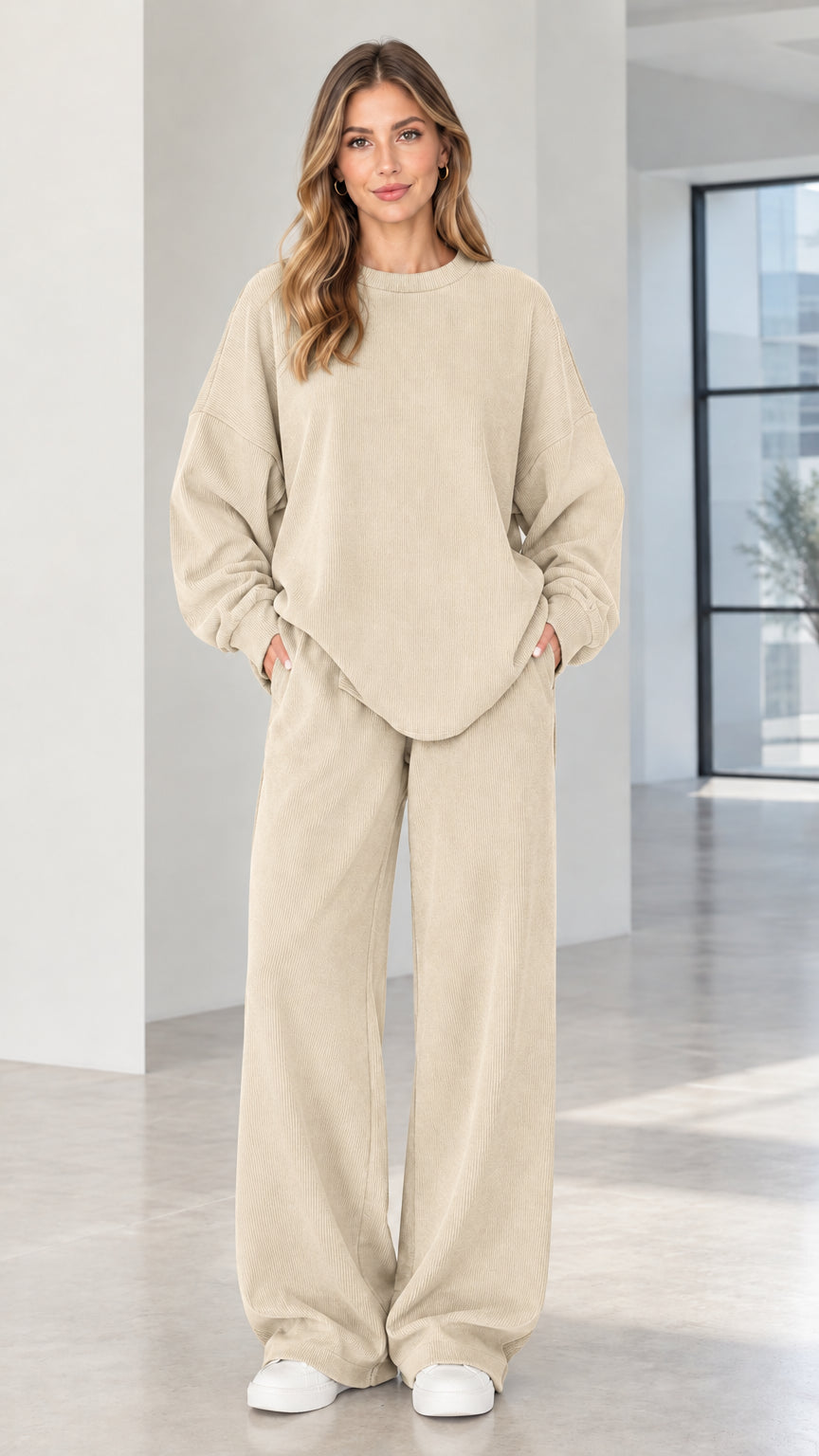 Woman wearing beige cream two-piece ribbed wide-leg lounge set