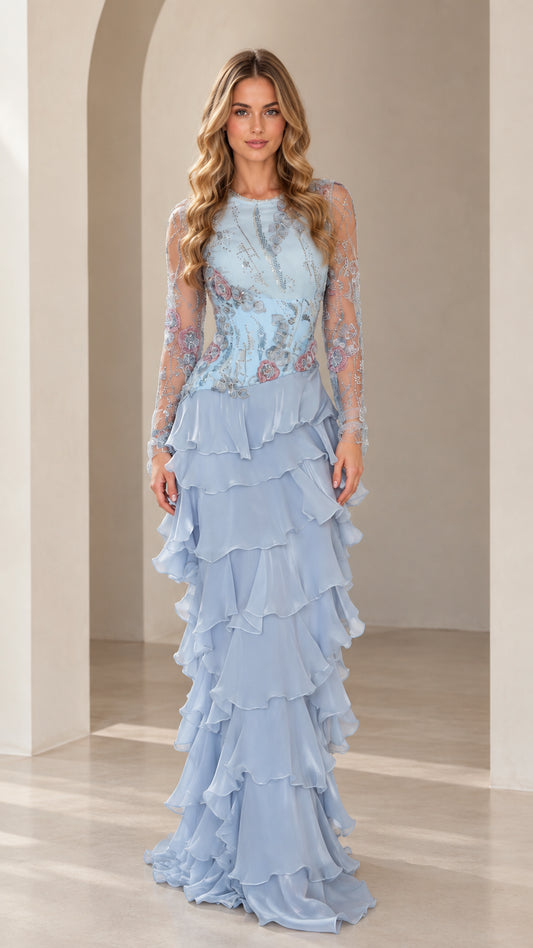 Front view of model wearing Sky Blue embroidered illusion long sleeve tiered ruffle maxi gown