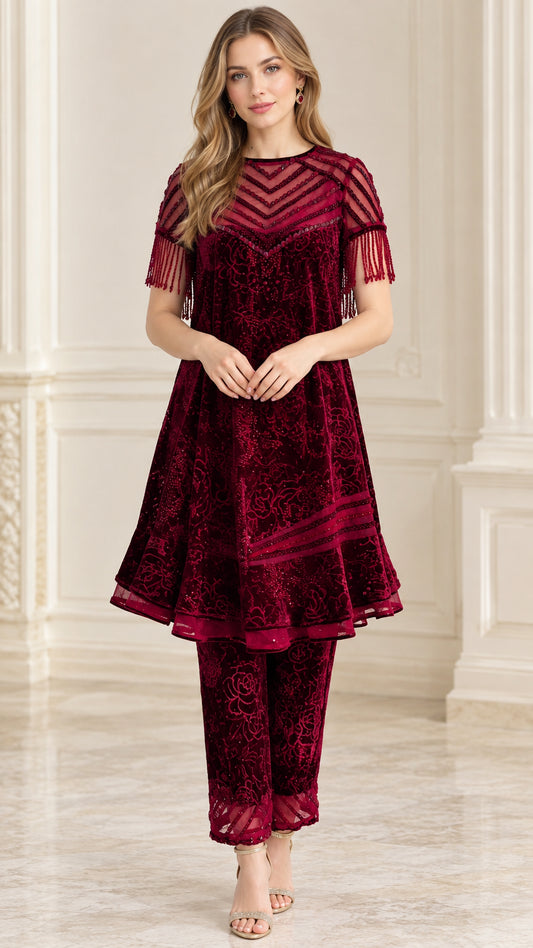 Front view of model wearing burgundy beaded sheer yoke velvet tunic and matching pants set