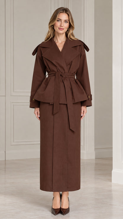 Front view of model wearing chocolate brown belted peplum jacket and maxi skirt set
