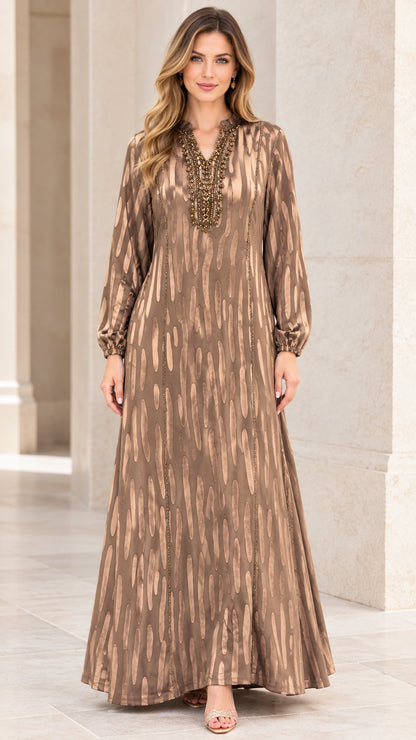 Front view of woman wearing Bronze beaded V-neck long sleeve maxi dress