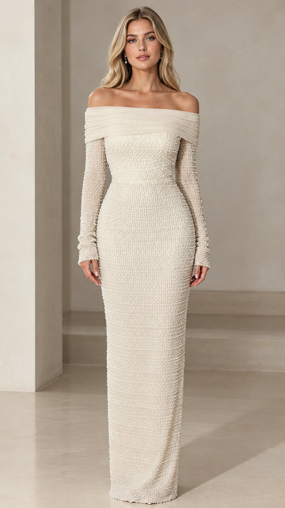 Front view of model wearing ivory off-the-shoulder pearl embellished long sleeve maxi dress