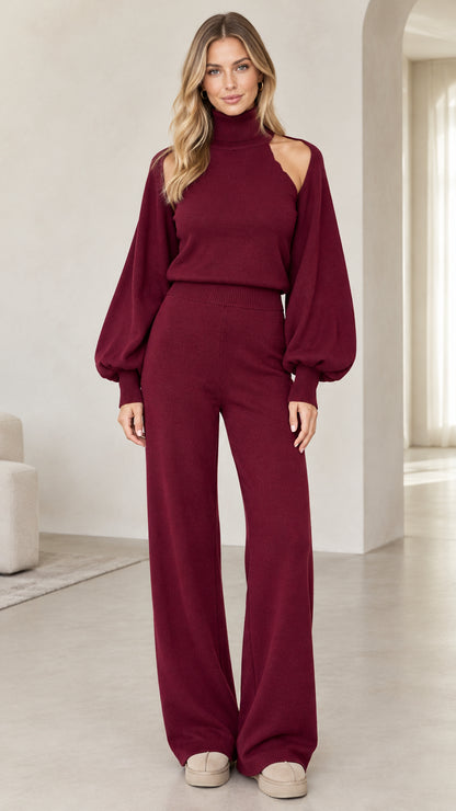 Woman wearing burgundy cutout turtleneck sweater and wide-leg knit pants set front view