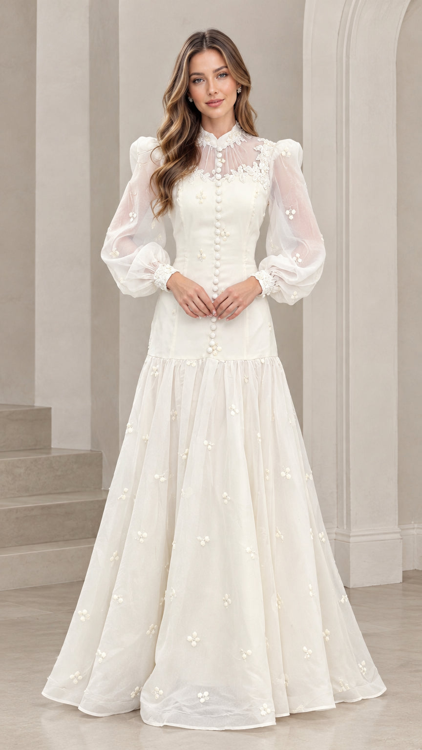 Front full-length view of woman wearing ivory high-neck lace long sleeve maxi gown