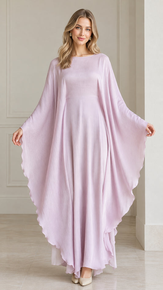 Front view of woman wearing flowing lavender draped cape sleeve kaftan maxi dress