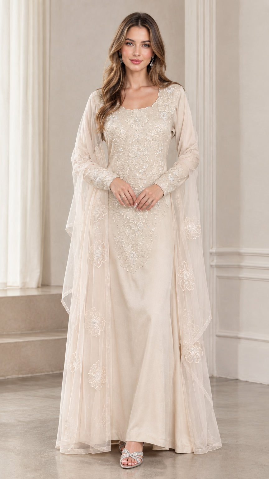 Front view of woman wearing champagne floral embroidered lace evening gown with cape drape