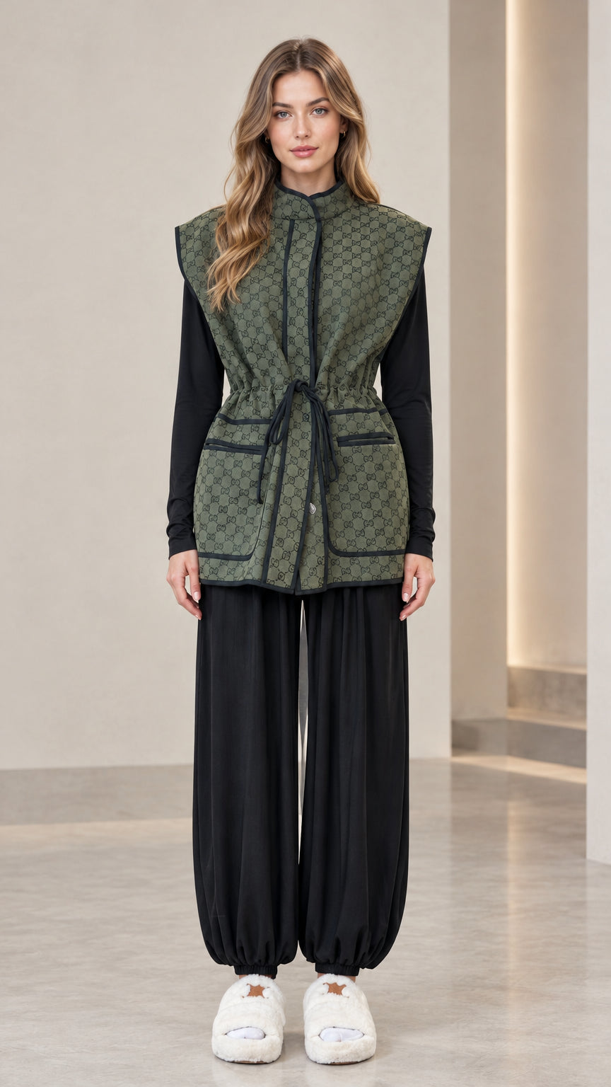 Front full view of woman wearing olive green monogram drawstring waist vest