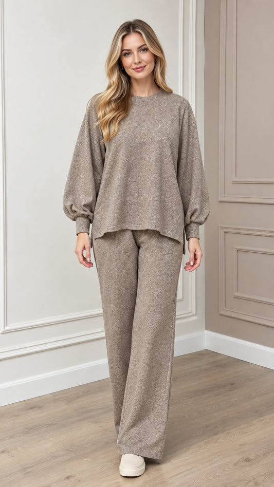 Full front view of model wearing taupe textured knit lounge set with lantern sleeves and wide-leg pants
