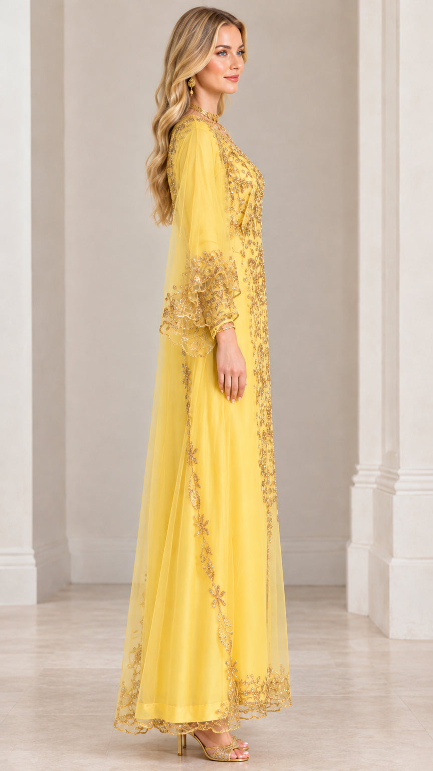 Side profile of woman in yellow embellished evening kaftan maxi dress