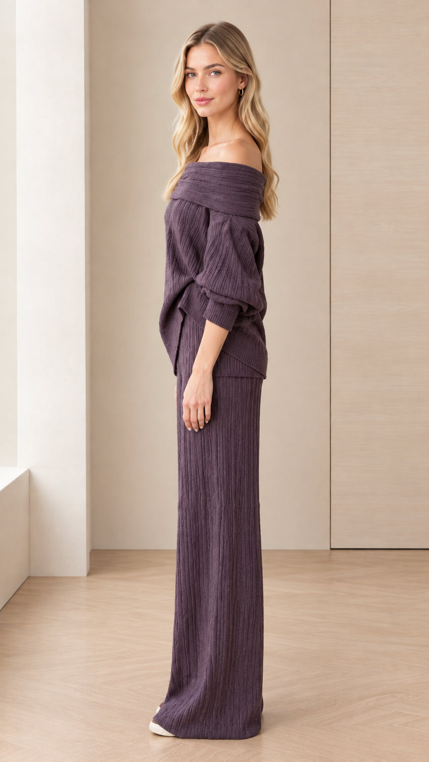 Side angle view of model posing in dark plum two-piece knit lounge outfit