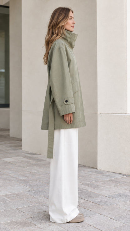 Side profile view of Sage Green relaxed belted short trench coat