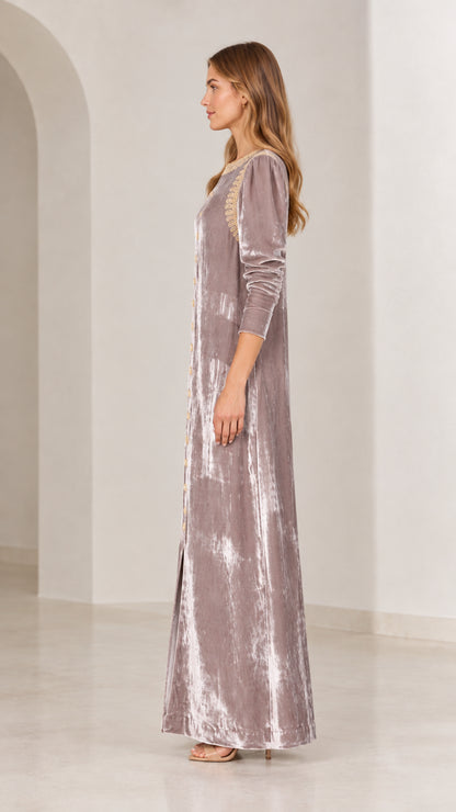 Side profile view of mauve crushed velvet maxi dress