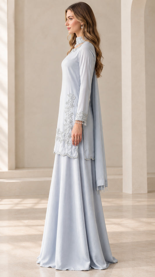 Side profile of woman wearing Ice Blue embroidered tunic and sharara pants
