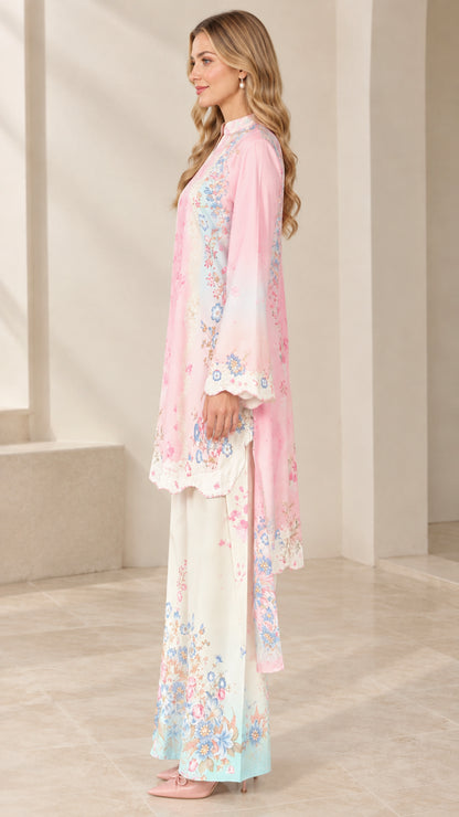 Side profile of pink floral print tunic set showing drape and matching dupatta