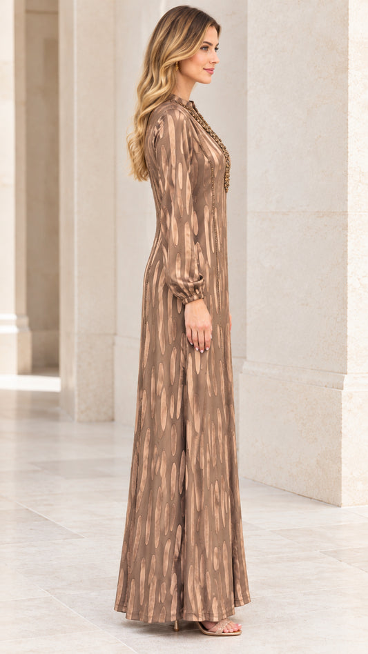 Side profile of Bronze embellished long sleeve floor-length maxi dress