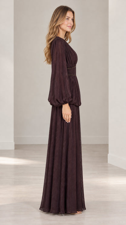 Side profile view of burgundy pleated evening gown with balloon sleeves