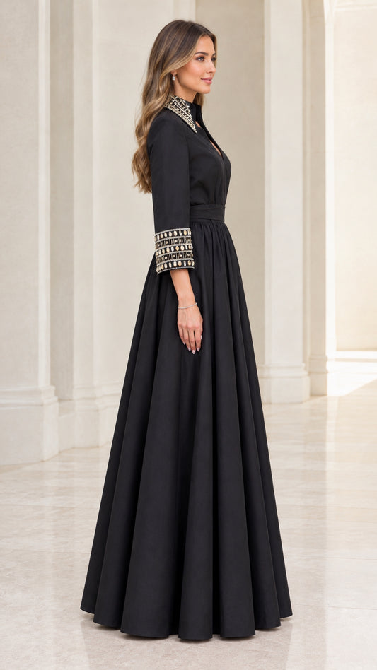 Side profile view of black formal maxi dress with beaded cuffs and full skirt