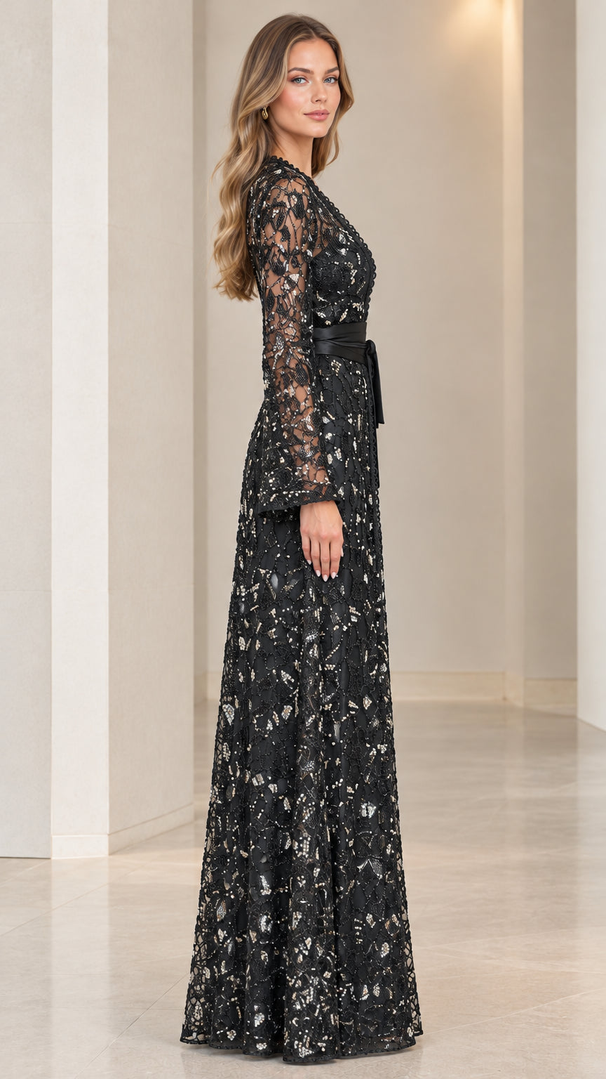 Side profile view of full length black sequined evening gown and long coat set