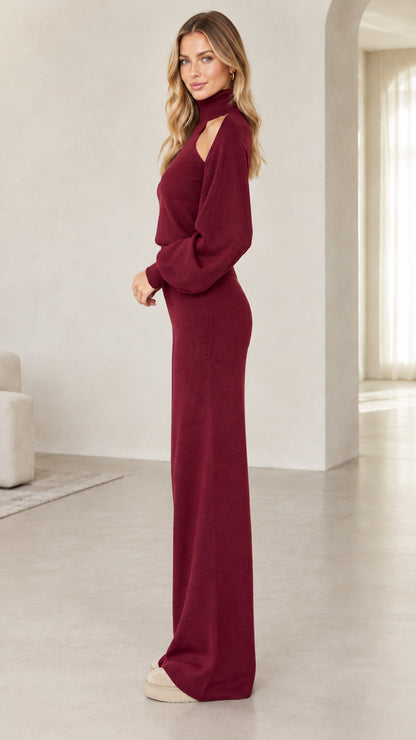 Side view of woman wearing burgundy knit two-piece sweater and wide-leg lounge pants