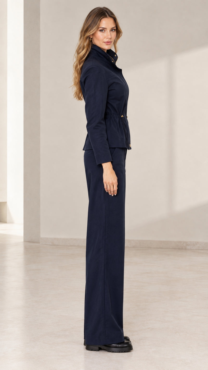 Side profile view of model in Navy Blue coordinating two-piece pant set
