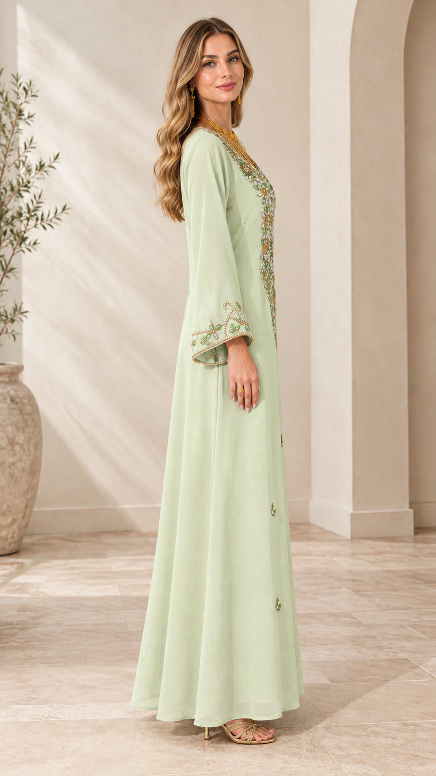 Side profile view of woman wearing Mint Green long sleeve embellished maxi dress