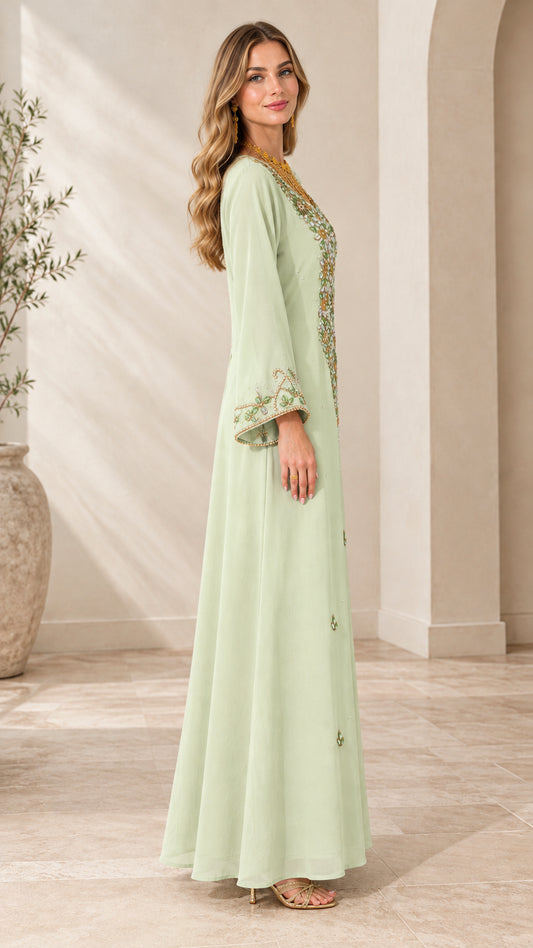 Side profile view of woman wearing Mint Green long sleeve embellished maxi dress